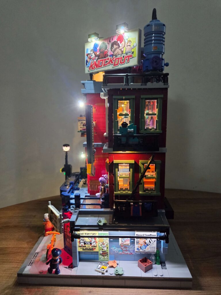 Lumibricks Boxing Club 19009 exterior with integrated LED lighting at night