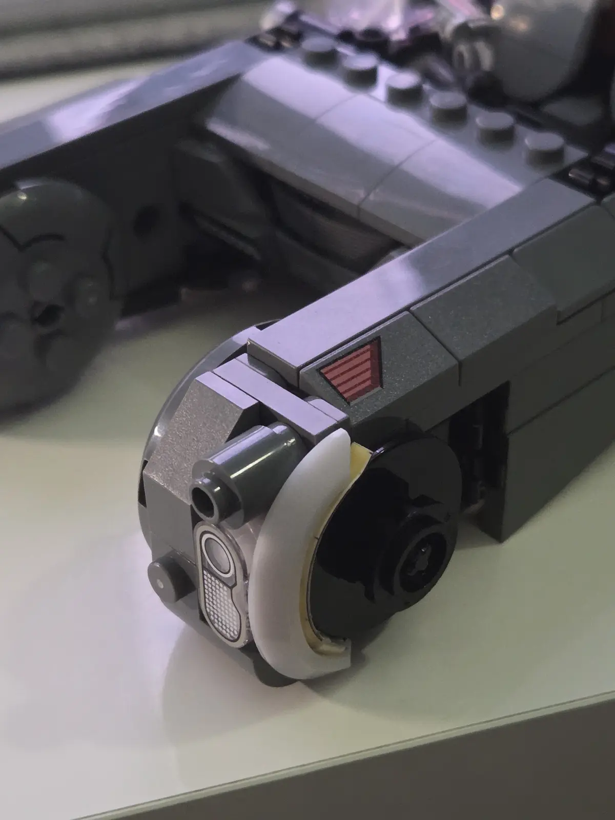 Close view of the printed front wheel pod and curved light assembly on K's Spinner