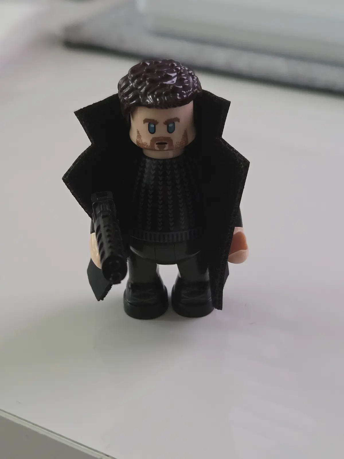 Lumibricks Officer K minifigure with layered coat, messy hair and blaster