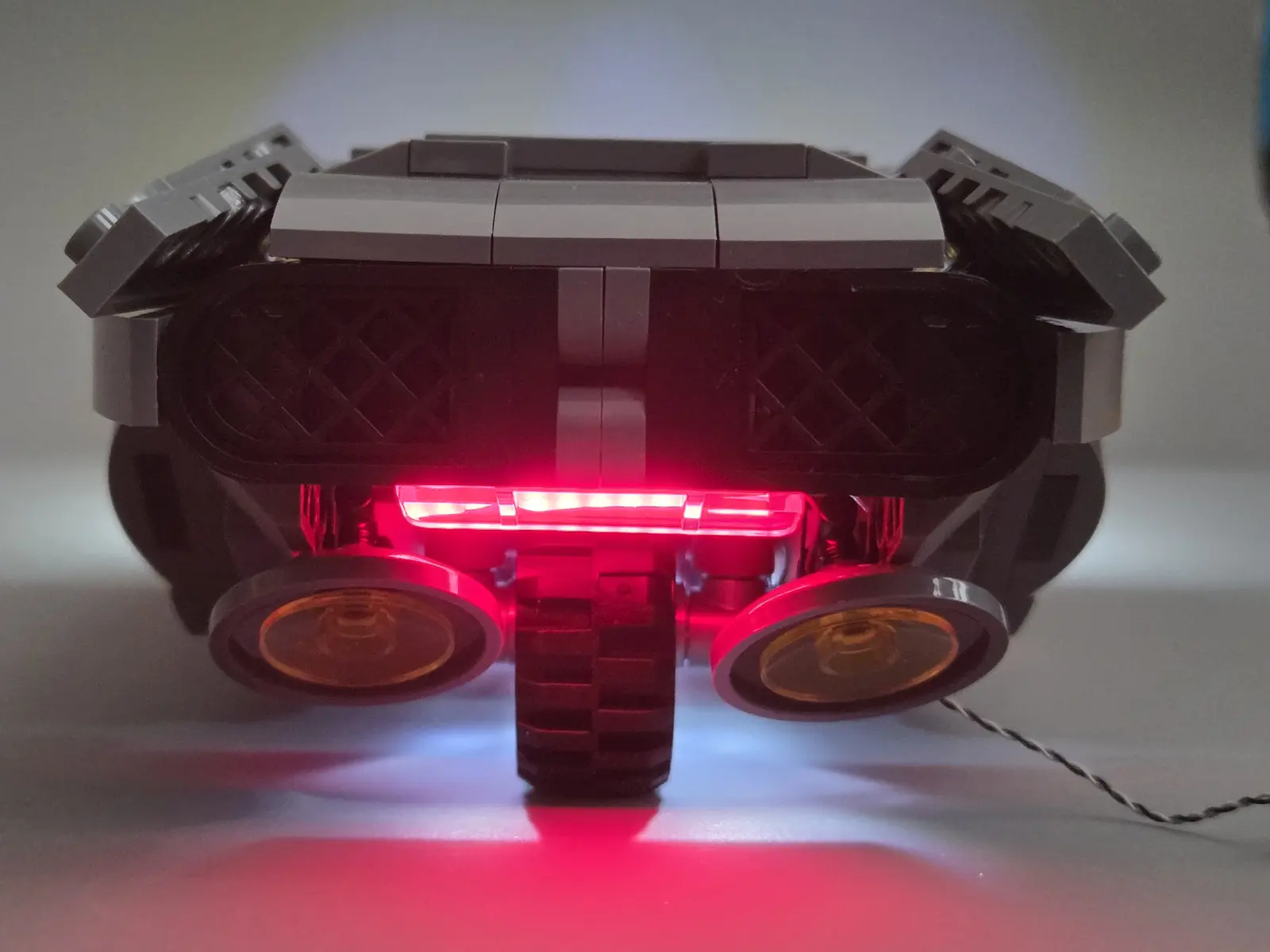 Rear view of K's Spinner with its wide red light illuminated