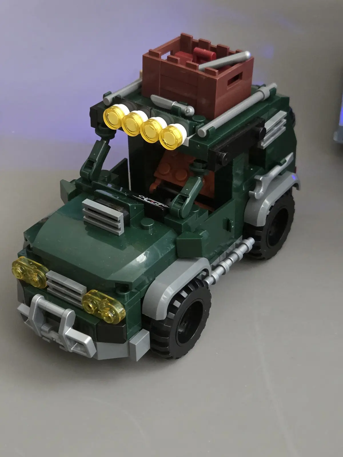 Green off-road vehicle included with the IAMBRICK Doomsday Gas Station