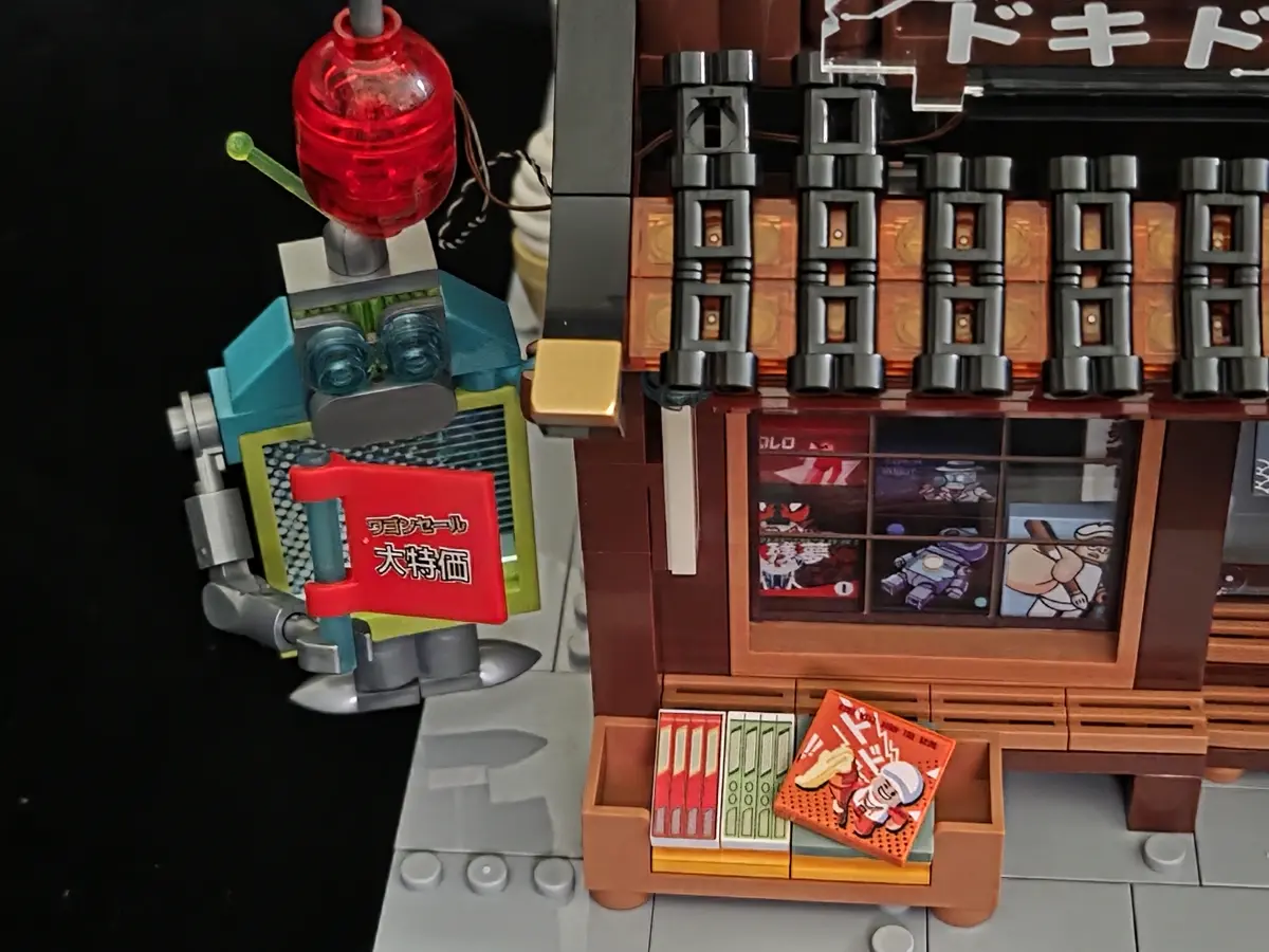 Manga Shop entrance mascot, red lantern and outdoor bargain rack