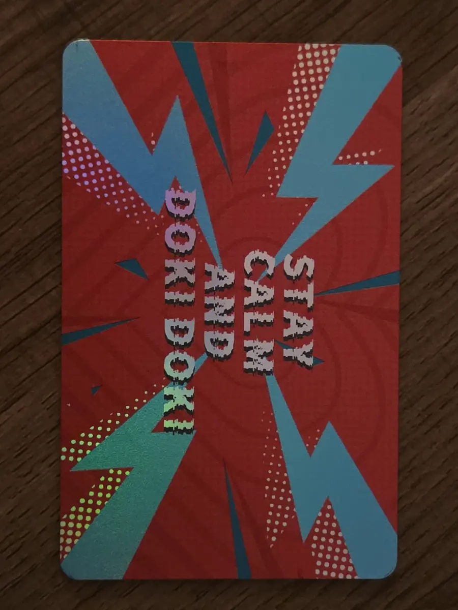 Reverse of the Manga Shop card reading Stay Calm and Doki Doki