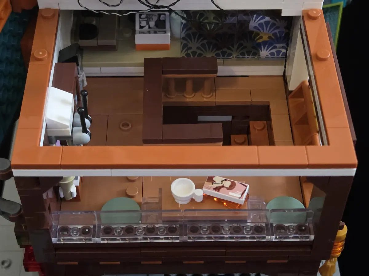Upper reading room with low table, drink and manga