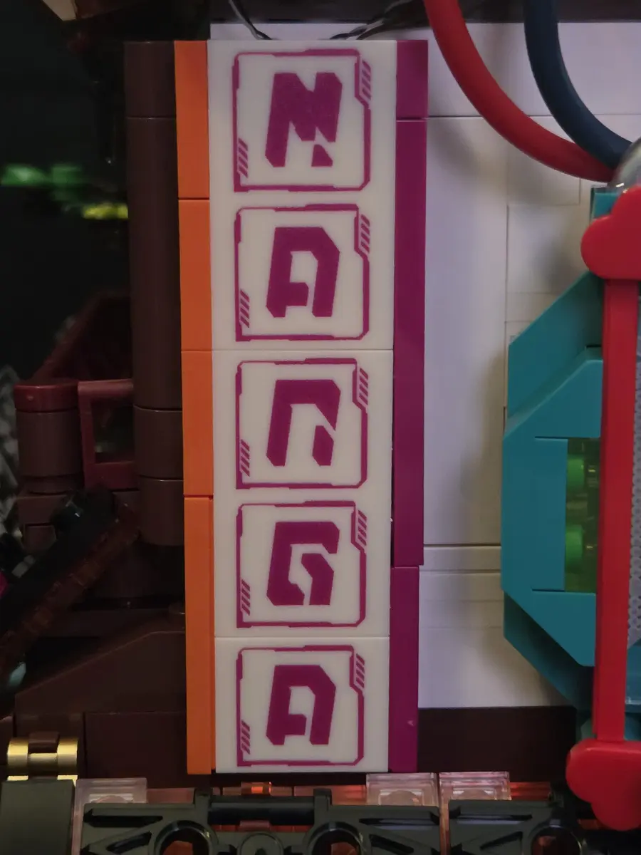 Vertical Manga Shop sign built from aligned printed tiles
