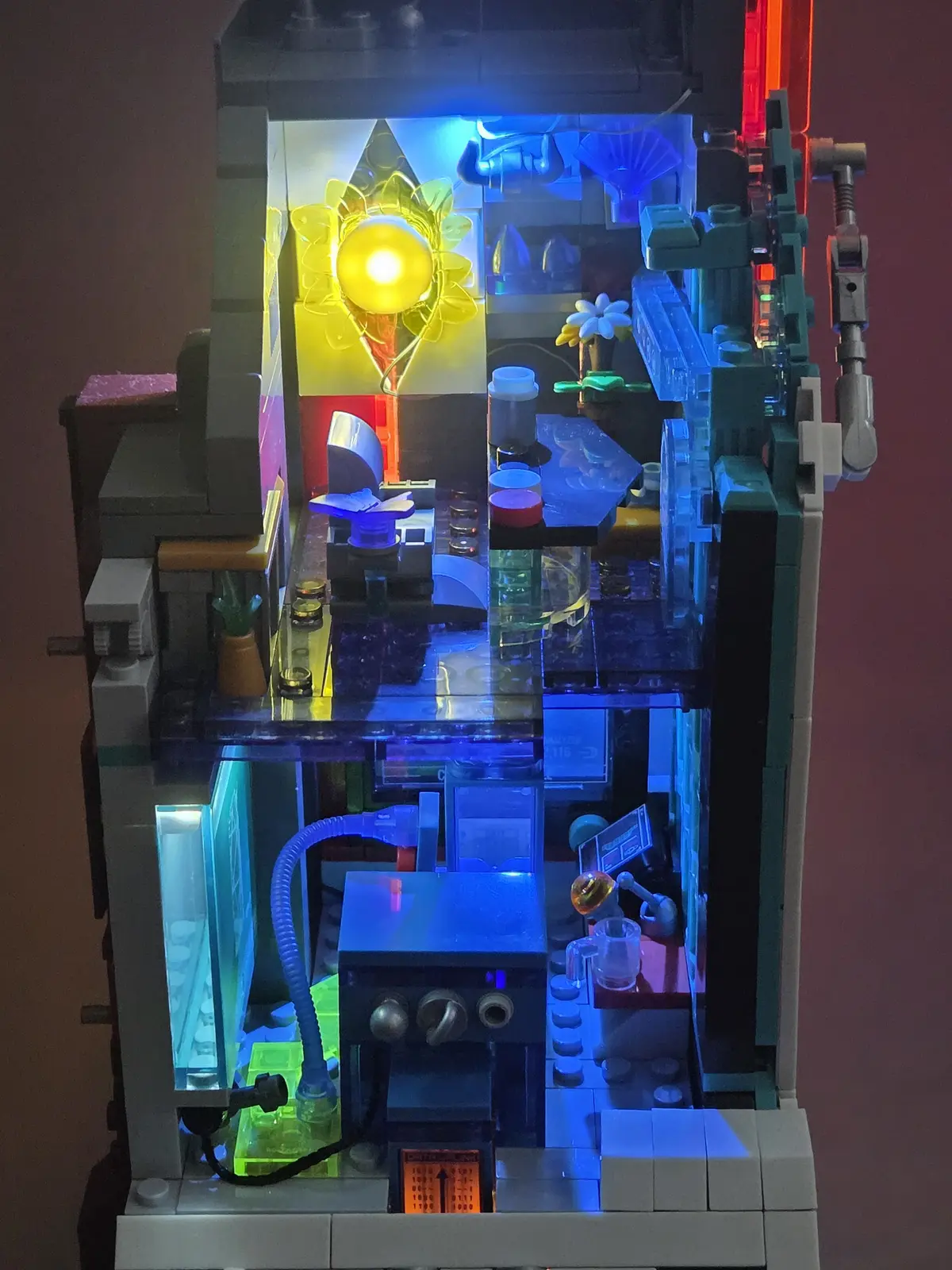 Illuminated upper rooms inside the Lumibricks Neon Tech Tower 17011