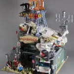 IAMBRICK Wrecked Plane Pharmacy 30902 completed model with crashed aircraft, watchtower and ambulance