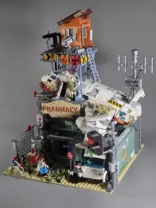 IAMBRICK Wrecked Plane Pharmacy 30902 completed model with crashed aircraft, watchtower and ambulance