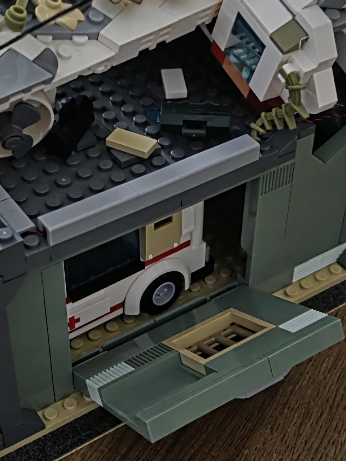 Open garage-side panel with ambulance visible inside the Wrecked Plane Pharmacy