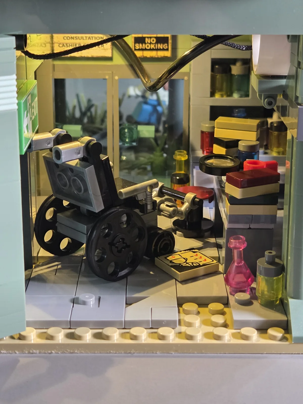 Wrecked Plane Pharmacy interior with wheelchair, medicine bottles, books and tiled floor