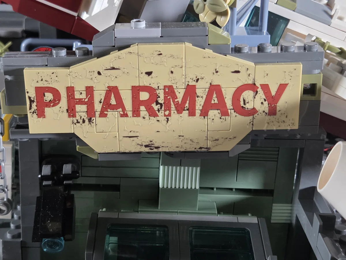 Large weathered Pharmacy sign decorated with a transfer