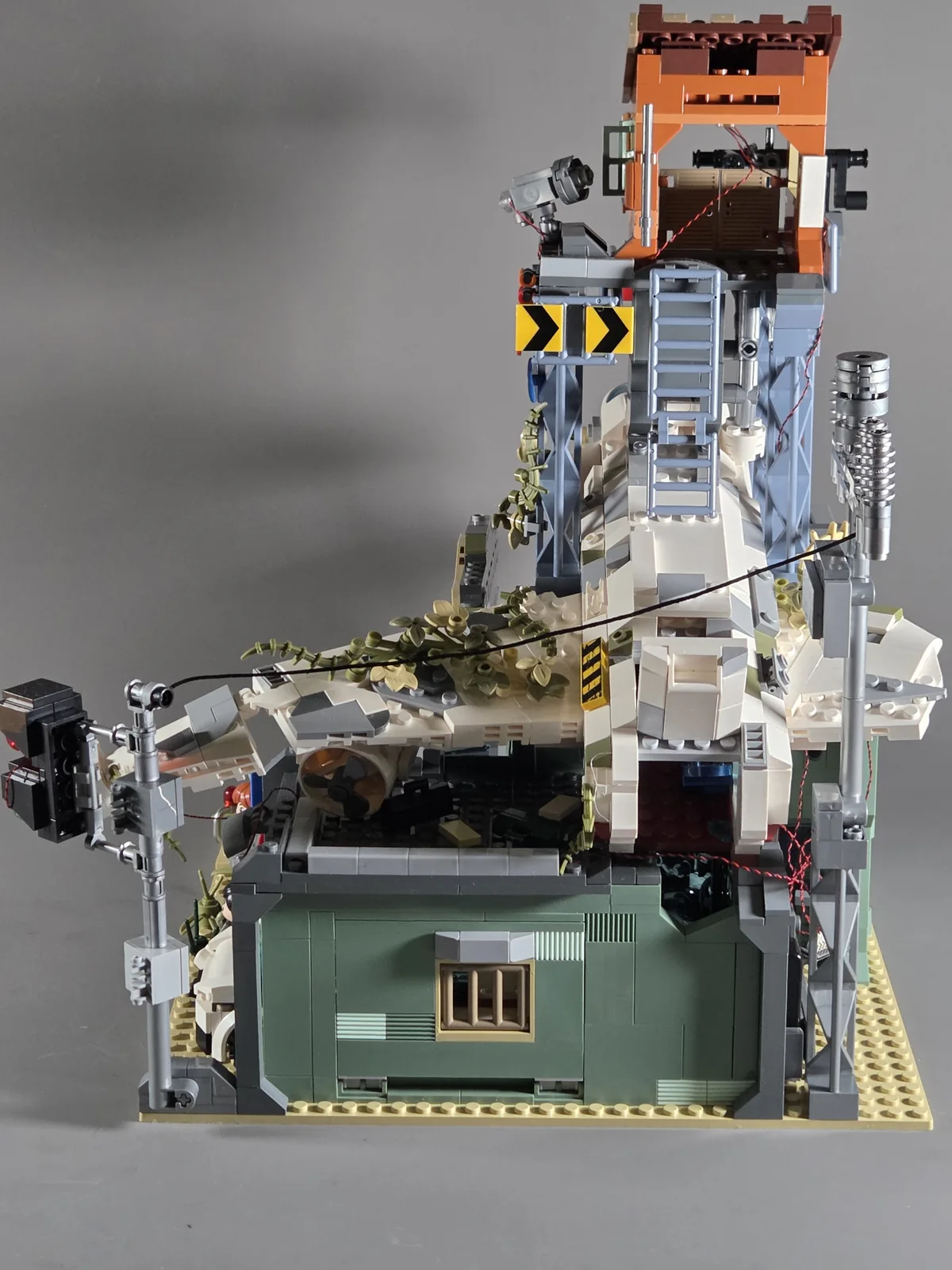 Side view of the Wrecked Plane Pharmacy showing the aircraft and supports below the watchtower