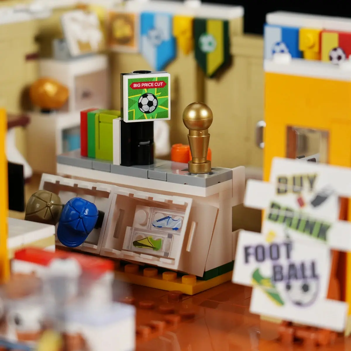 Football Fan Pub shop counter with printed football boot tiles, moulded caps and a gold trophy